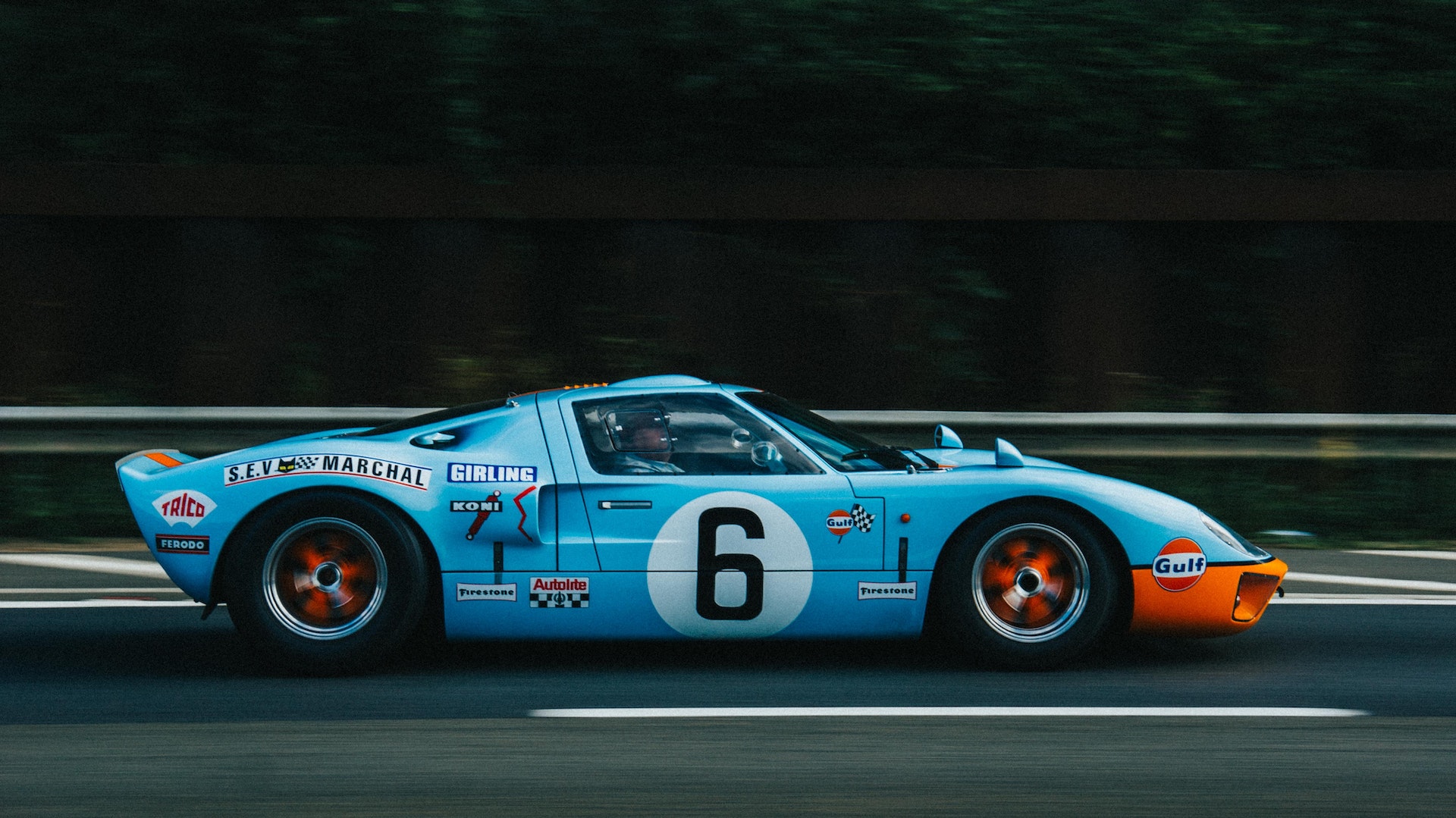 side of Ford GT40 racing down street